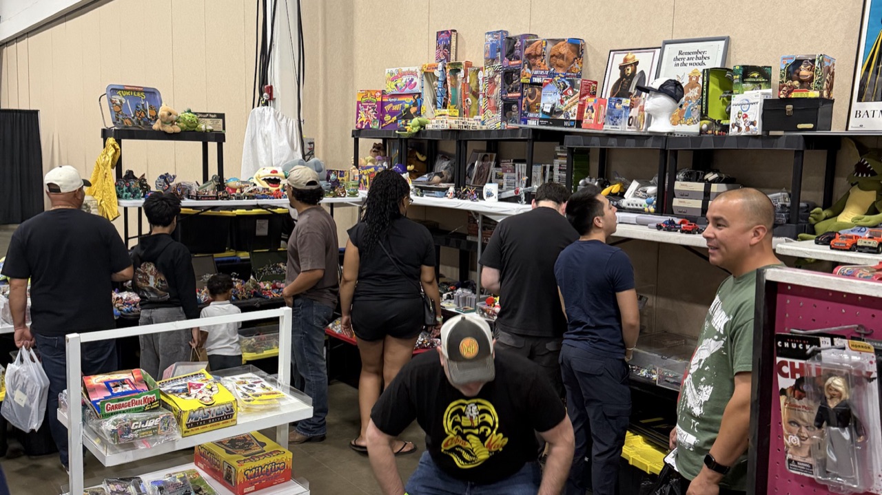 Collectors hunting through vintage toys and trading cards at Dominion Toy Con