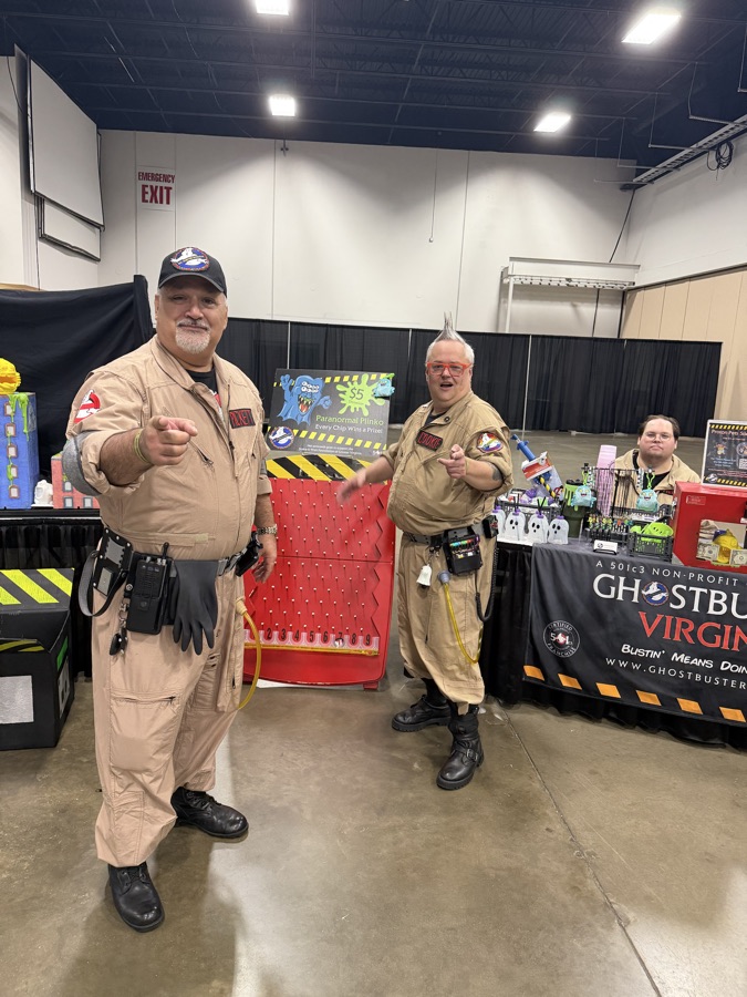 Ghostbusters cosplayers inviting attendees to play Paranormal Plinko